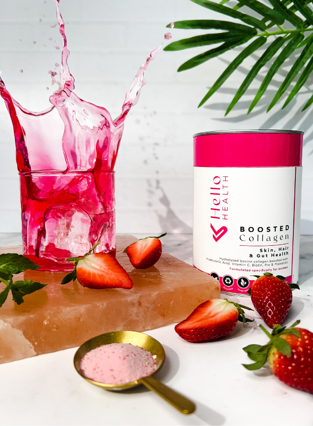 An image of a sugar free delicious pink collagen drink that has been fortified with biotin, vitamin c, pre & probiotics and hyaluronic acid on a marble counter 